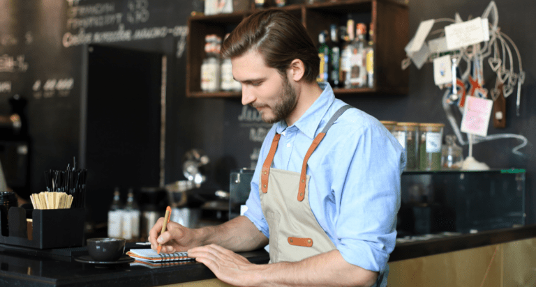 Business owner working in cafe